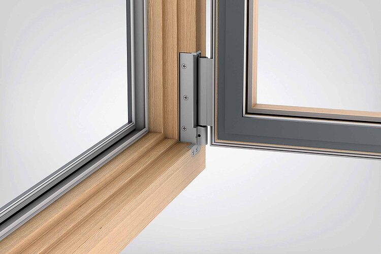 Para ventanas y puertas balconeras de madera y madera-aluminio: el diseño del robusto lado de bisagra Roto NX | Power Hinge impresiona por su aspecto uniforme y de alta calidad. Viene fabricado de serie con una superficie plateada recubierta en polvo, pe