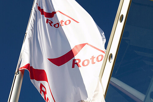Roto flag under blue sky